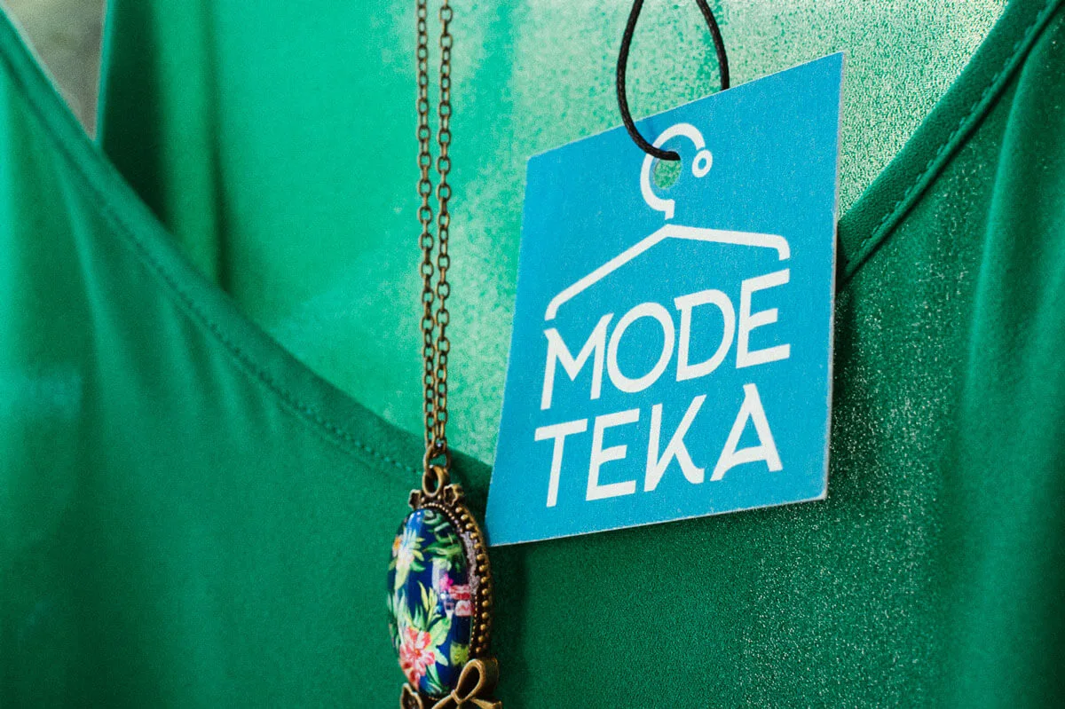 Photograph of green shirt with a MODETEKA label.