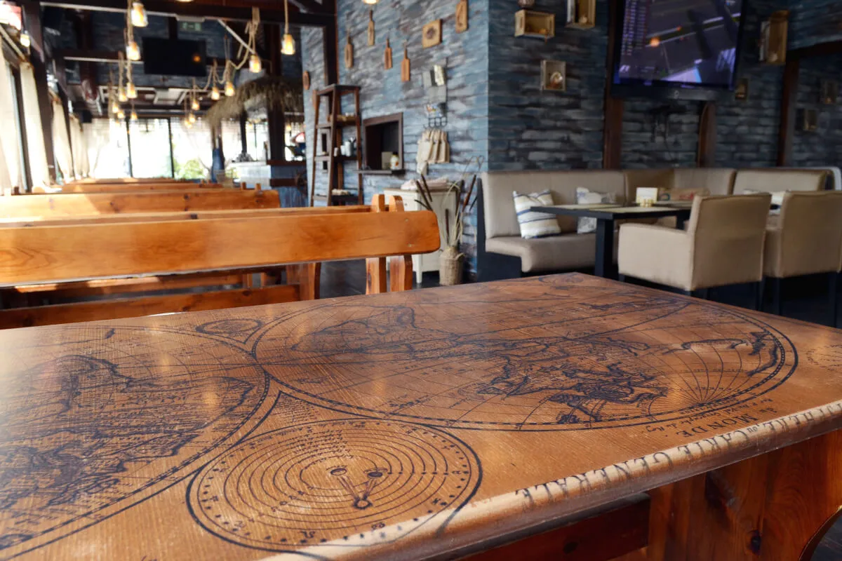 A photograph of The old man and the sea restaurant interior and custom decor and branded tables.