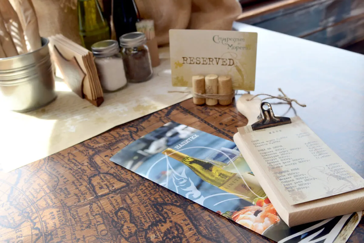 A photograph of The old man and the sea restaurant custom-made menus and tableware.
