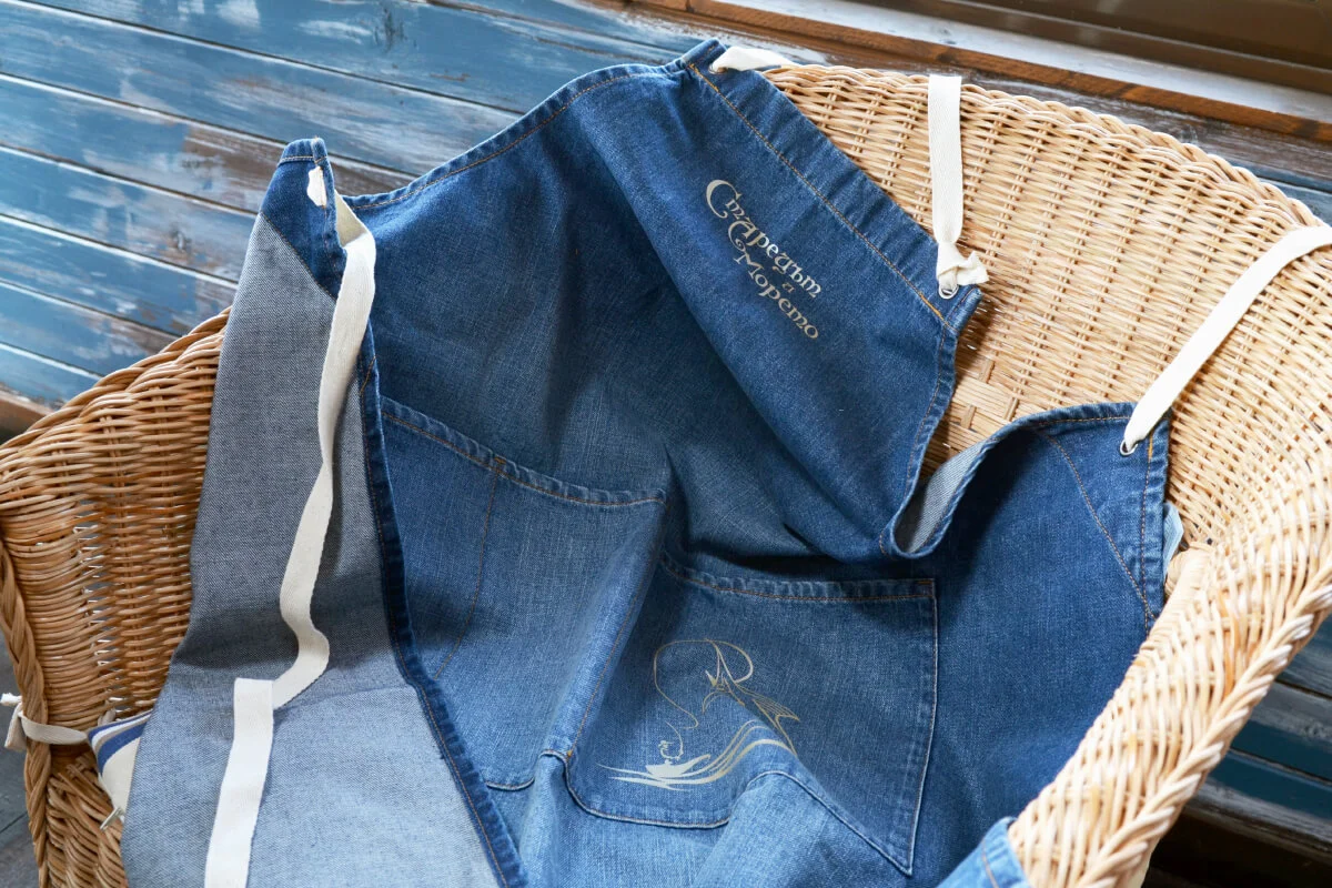 A photograph of The old man and the sea restaurant's custom-made staff aprons.