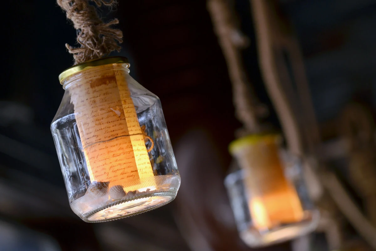 A photograph of The old man and the sea restaurant's custom-made lighting made from glass jars.