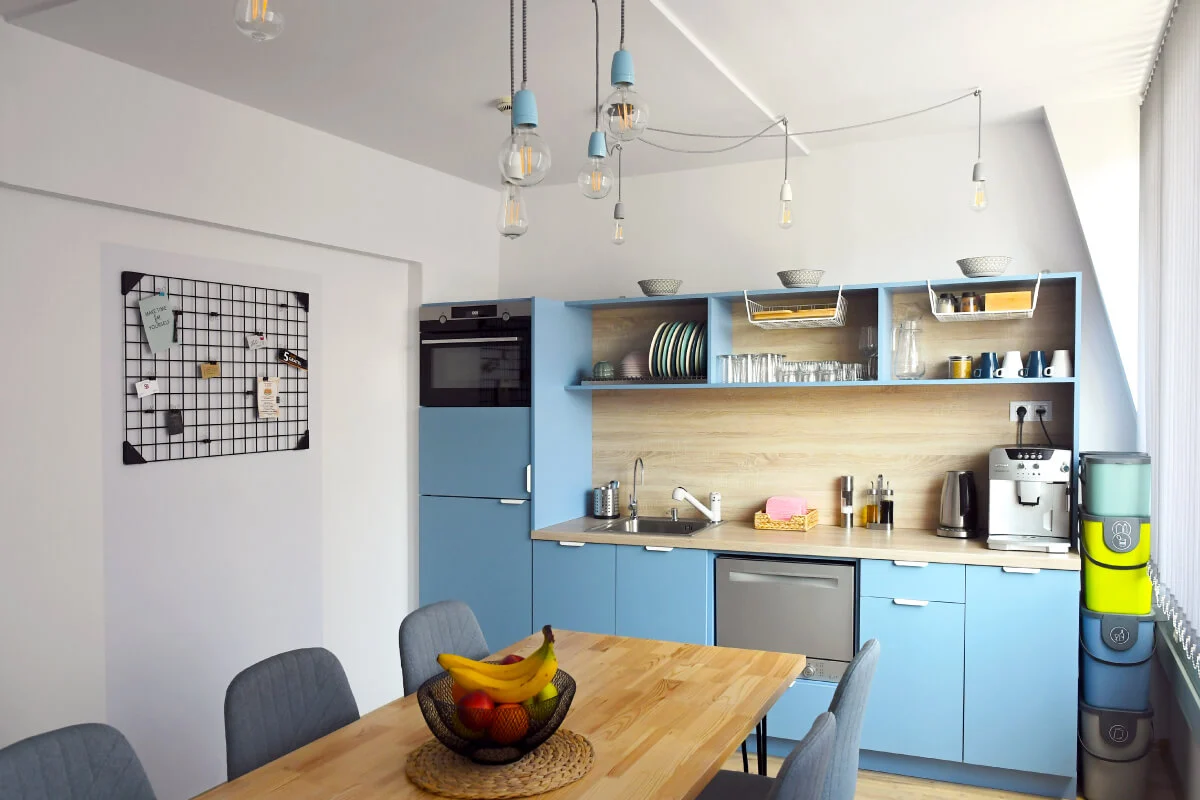 A front view of the custom-made kitchen and lighting at the Parachut's office.