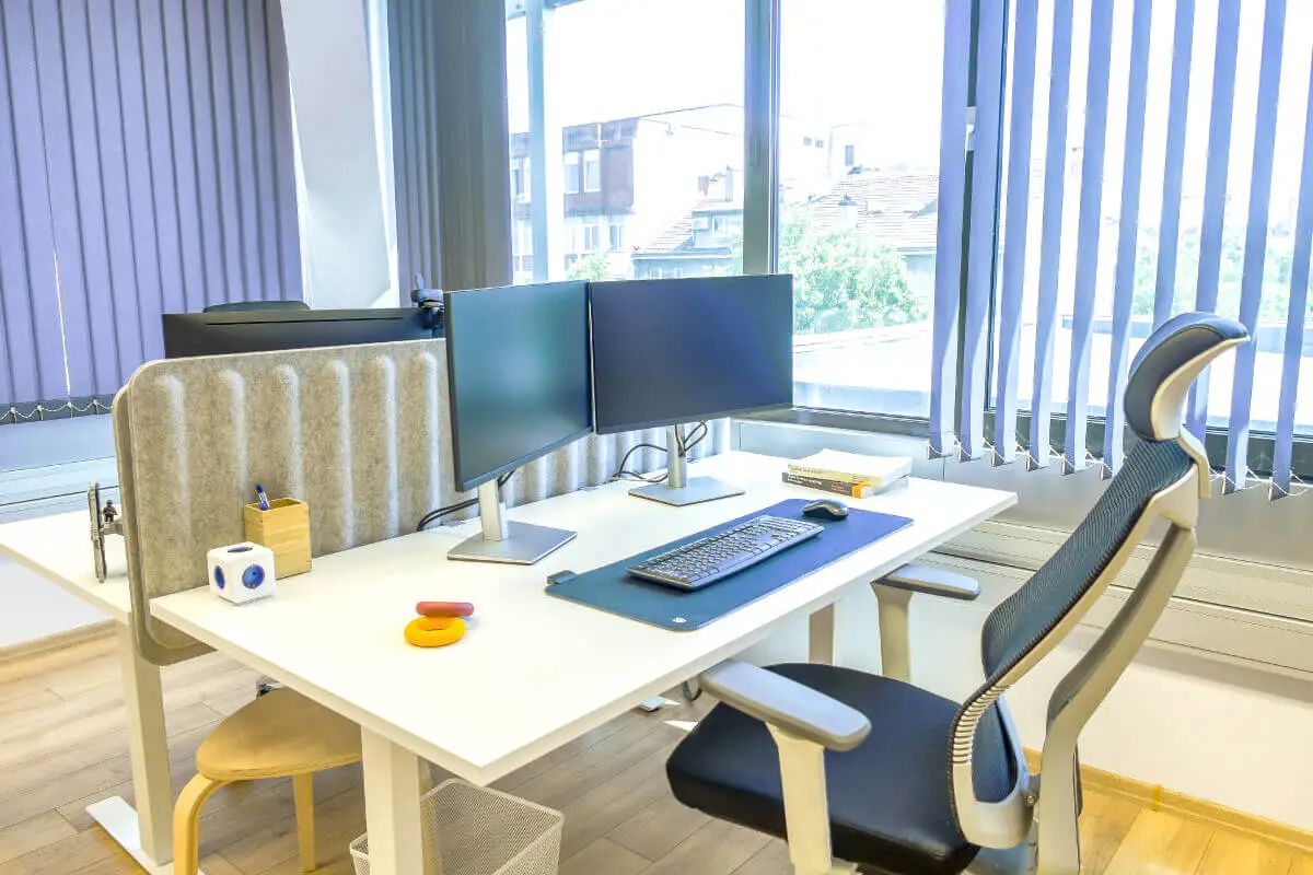 A photograph of a standing desk workstation at the Parachut office.