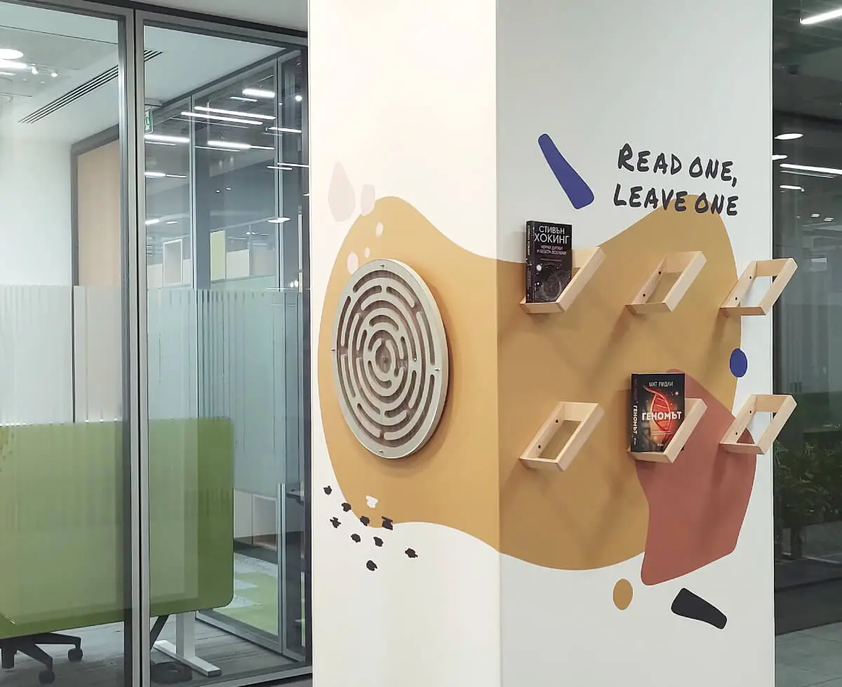 A custom 3D labyrinth game and a small library we designed and installed for one of the dining areas in the VMware offices.