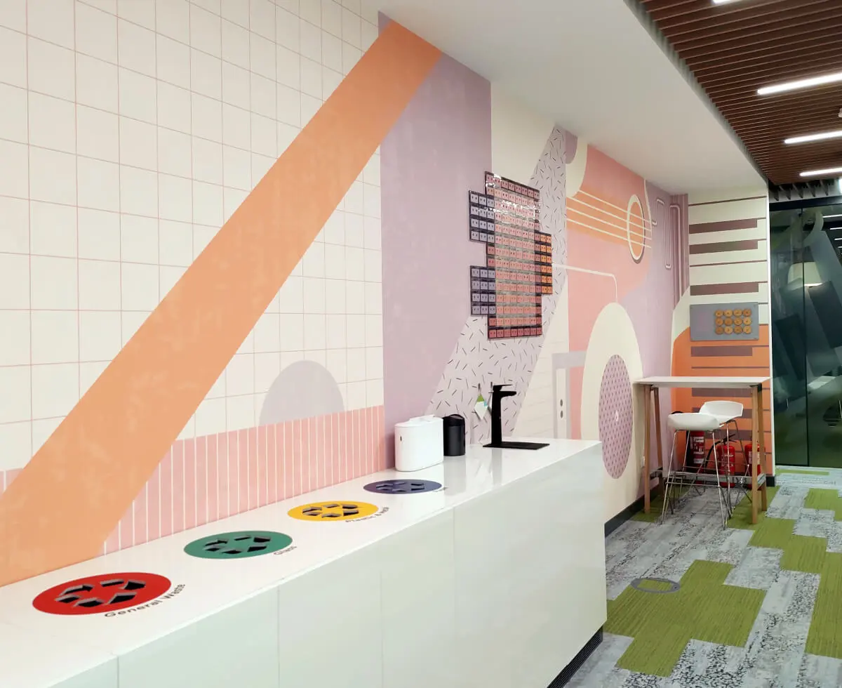 A custom wallpaper with 3D decoration made from cassette tapes we designed and installed for one of the printing zones in the VMware offices.