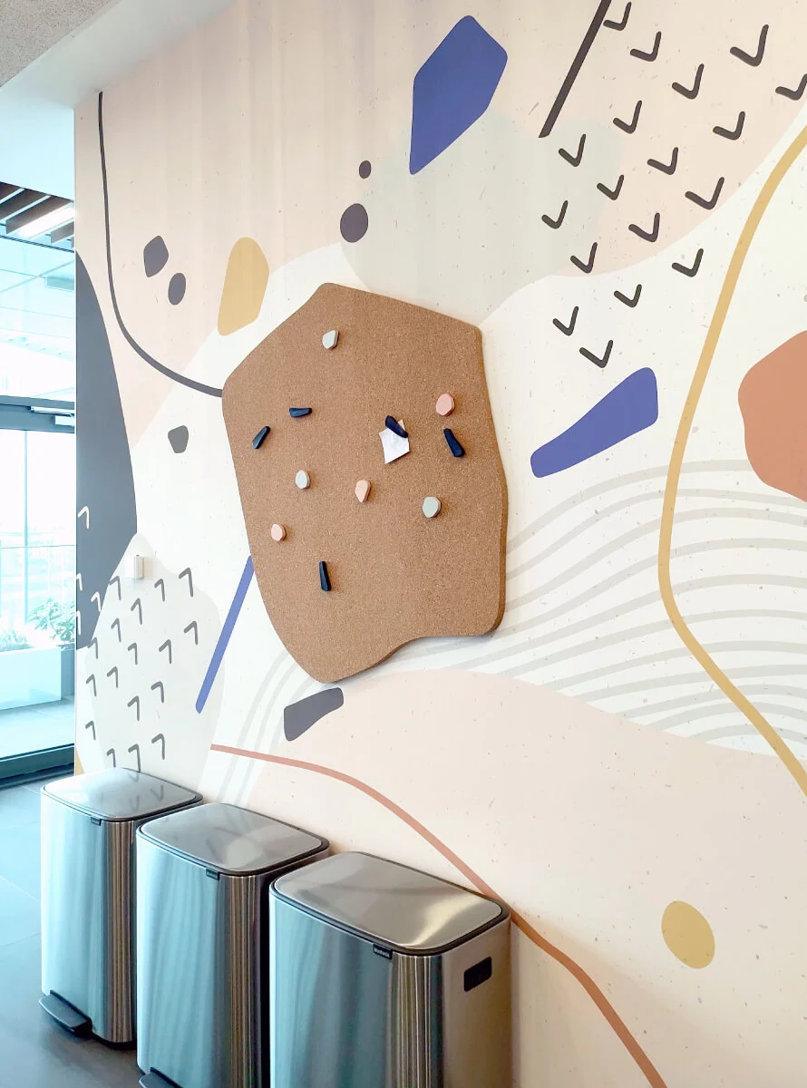 A custom wallpaper with a custom cork board we designed and installed for one of the kitchens in the VMware offices.
