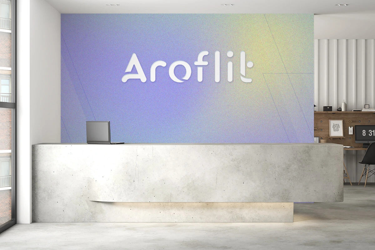 Custom wallpaper and a 3D logo at an office reception.