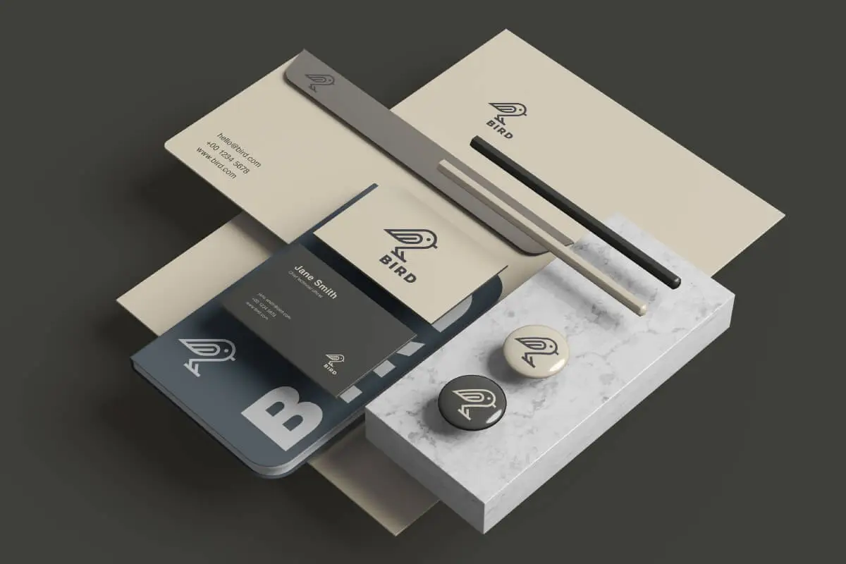 Branded company materials with custom print for employer branding, including business cards, badges, notebook.